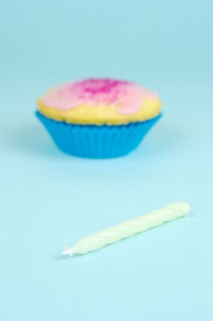 Cup cakes isolated against a blue backgroundの写真素材