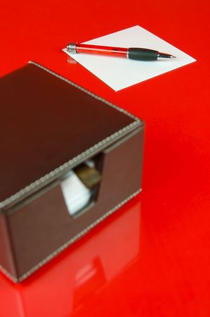 A note block isolated against a red backgroundの写真素材