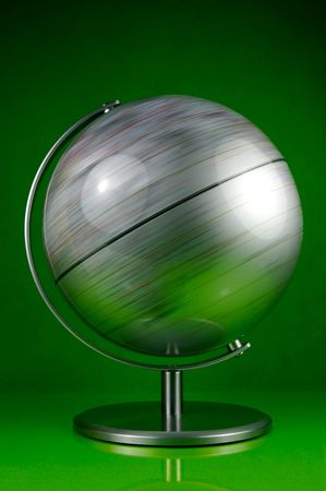 A world globe isolated against a green backgroundの写真素材