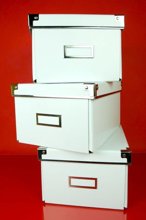 Storage boxes isolated against a red background
