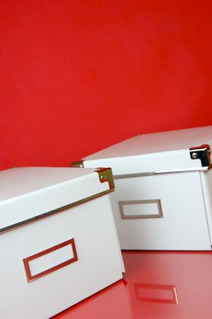Storage boxes isolated against a red backgroundの写真素材