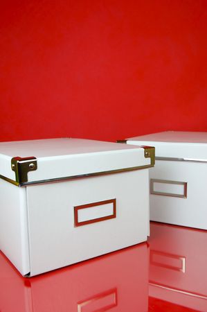 Storage boxes isolated against a red backgroundの写真素材