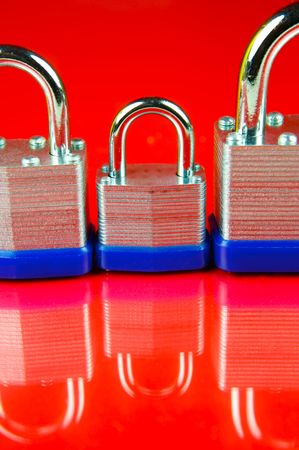 Padlocks isolated against a red background