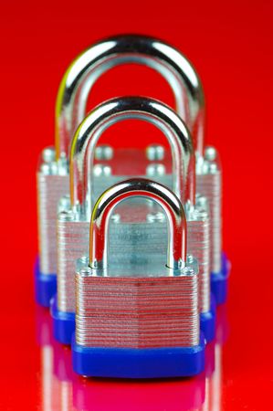 Padlocks isolated against a red background