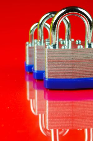 Padlocks isolated against a red background