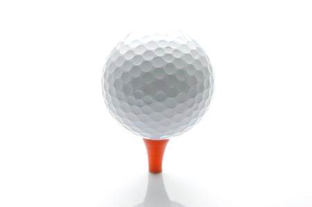A golf ball on a tee isolated against a white backgroundの写真素材