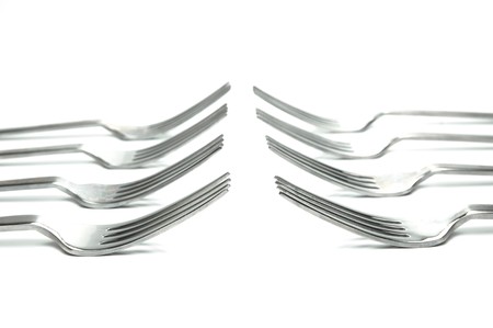 Silver table forks isolated against a white backgroundの写真素材