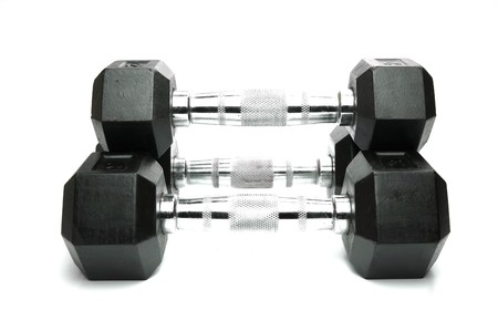 Weight lifting dumbbells isolated against a white backgroundの写真素材