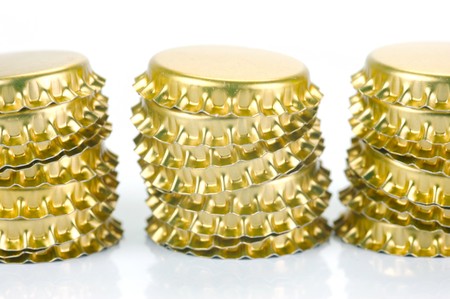 Bottle caps isolated against a white backgroundの写真素材