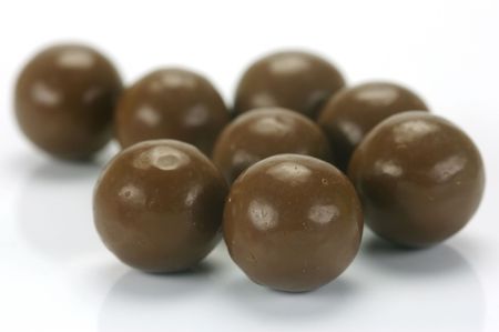 Chocolate balls isolated against a white backgroundの写真素材