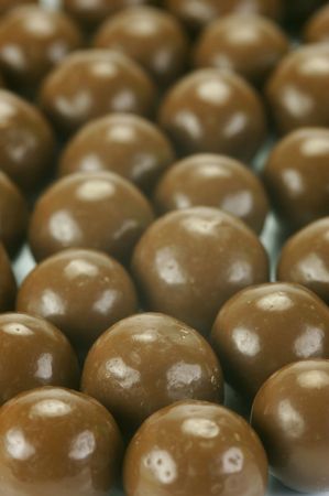 Chocolate balls isolated against a white backgroundの写真素材