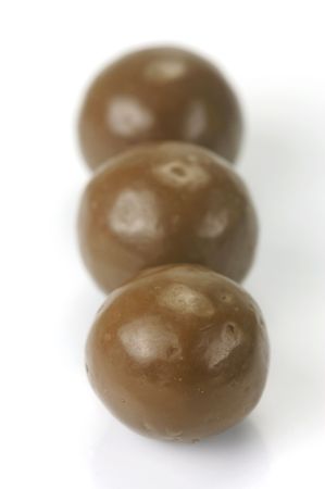 Chocolate balls isolated against a white backgroundの写真素材