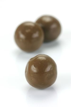 Chocolate balls isolated against a white backgroundの写真素材