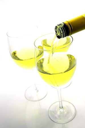 Glasses of white wine isolated against a white backgroundの写真素材