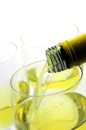 Glasses of white wine isolated against a white backgroundの写真素材