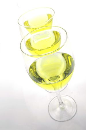 Glasses of white wine isolated against a white backgroundの写真素材