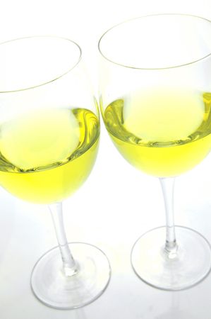 Glasses of white wine isolated against a white backgroundの写真素材