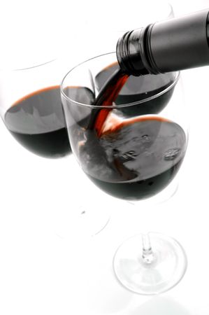 Glasses of red wine isolated against a white backgroundの写真素材