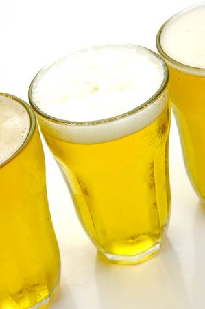 Glasses of beer isolated against a white backgroundの写真素材