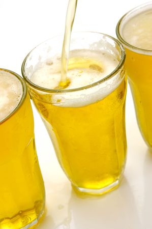 Glasses of beer isolated against a white backgroundの写真素材