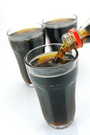 Glasses of cola isolated against a white backgroundの写真素材