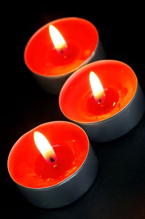 Scented candals isolated against a black backgroundの写真素材