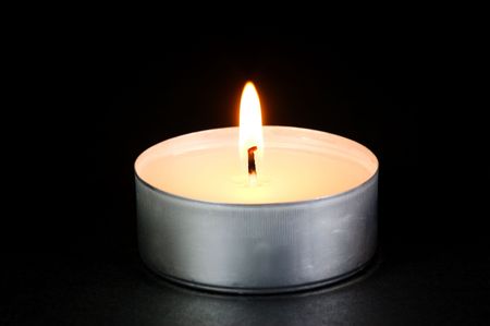 Scented candals isolated against a black backgroundの写真素材