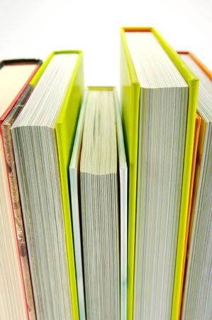 Reading glasses and books isolated against a white backgroundの写真素材