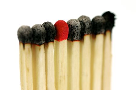 Red head matches isolated against a white backgroundの写真素材