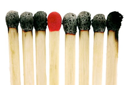 Red head matches isolated against a white backgroundの写真素材