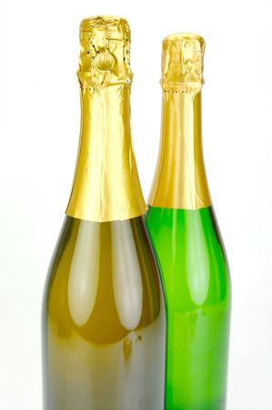 Bottles of sparkling wine isolated agaisnt a white backgroundの写真素材