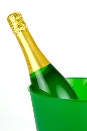 Bottles of sparkling wine in an ice bucket isolated agaisnt a white backgroundの写真素材