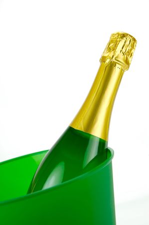 Bottles of sparkling wine in an ice bucket isolated agaisnt a white backgroundの写真素材
