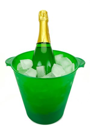 Bottles of sparkling wine in an ice bucket isolated agaisnt a white backgroundの写真素材