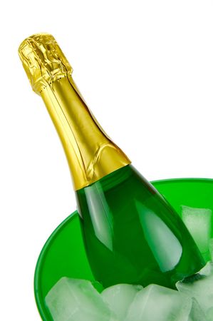 Bottles of sparkling wine in an ice bucket isolated agaisnt a white backgroundの写真素材
