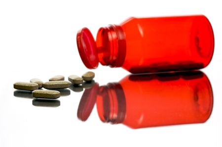 Vitamin tablets in containers isolated and backlitの写真素材