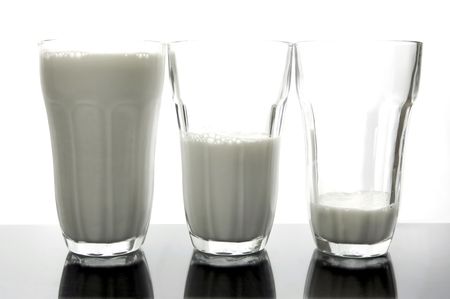 Glasses of milk isolated against a white backgroundの写真素材