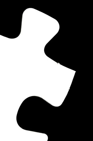 Jigsaw pieces isolated against a black backgroundの写真素材