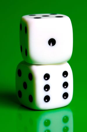 Dice isolated against a green backgroundの写真素材