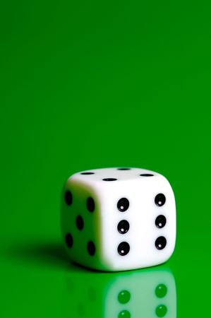 Dice isolated against a green backgroundの写真素材