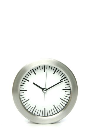 An analogue clock set against a white backgroundの写真素材