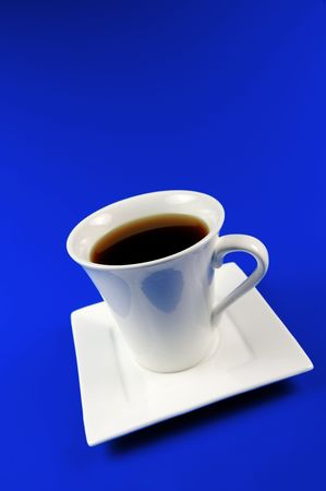 Black coffee isolated against a bluebackgroundの写真素材
