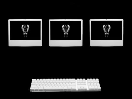 A desktop computer isolaterd against a black backgroundの写真素材