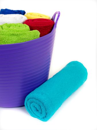 Colored bathroom towels isolated against a white backgroundの写真素材