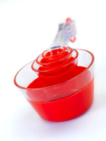 Measuring cups isolated against a blue backgroundの写真素材