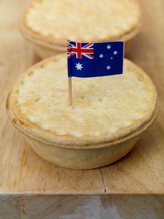 Australian meat pies on a chopping boardの写真素材