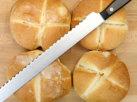 Fresh bread rolls isolated on a kitchen bench