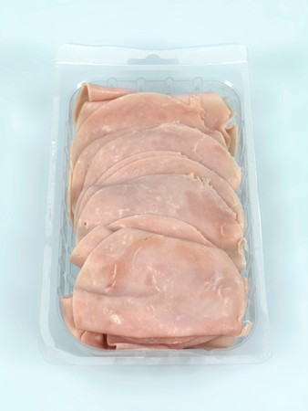 Sliced sandwich ham on a kitchen benchの写真素材