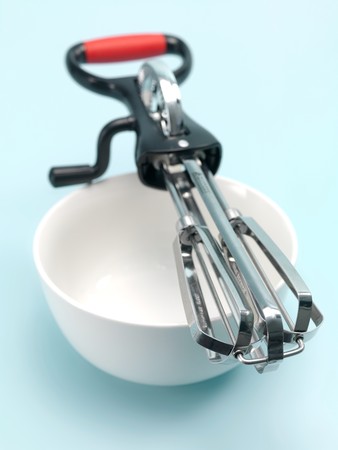 An egg beater on a kitchen bench