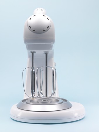 A food mixer isolated against a blue backgroundの写真素材